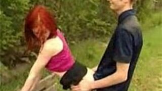 Redhead in Threesome in Park - porn video