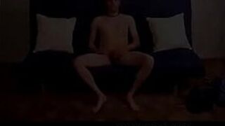 Horny stud tugging his hard cock on the couch - porn video